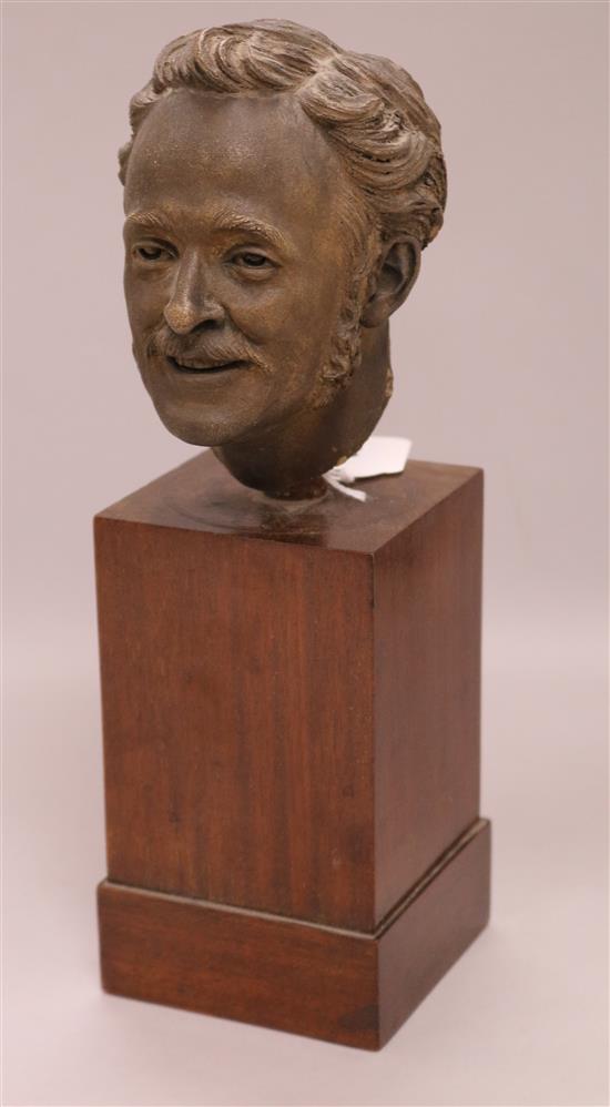 A mid 19th century terracotta head of a man, on stand overall height 29cm